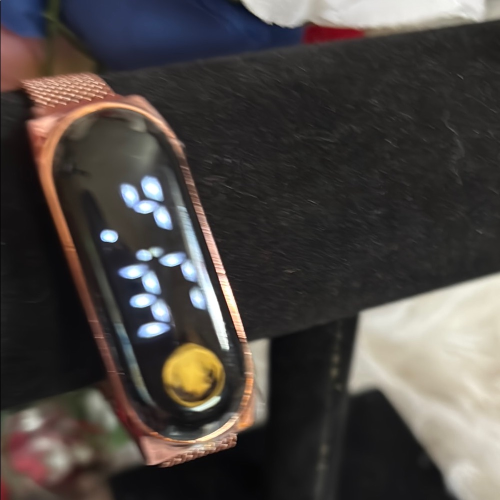 Gold Smartwatch with Sleek Design and Digital Display